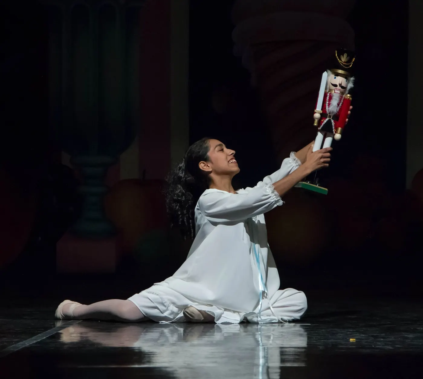 Clara holds up her Nutcracker in Ballet for Youth’s Nutcracker
